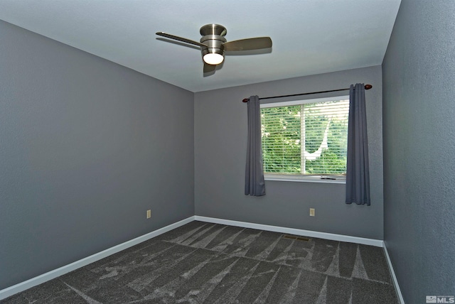 carpeted empty room featuring ceiling fan