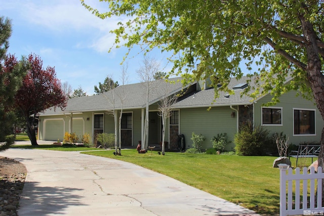 single story home featuring a garage and a front lawn