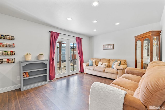 living room with dark wood-type flooring and french doors