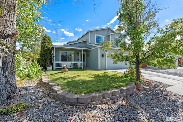 view of front facade featuring a front yard, a garage, and covered porch