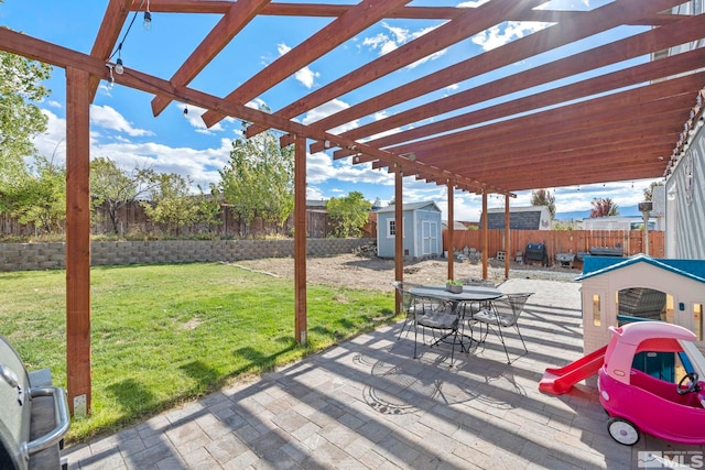 view of patio / terrace featuring a storage shed