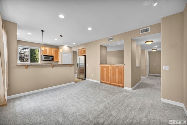 unfurnished living room featuring light carpet, recessed lighting, visible vents, and baseboards