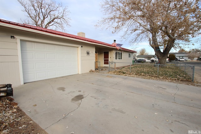 ranch-style home featuring a garage