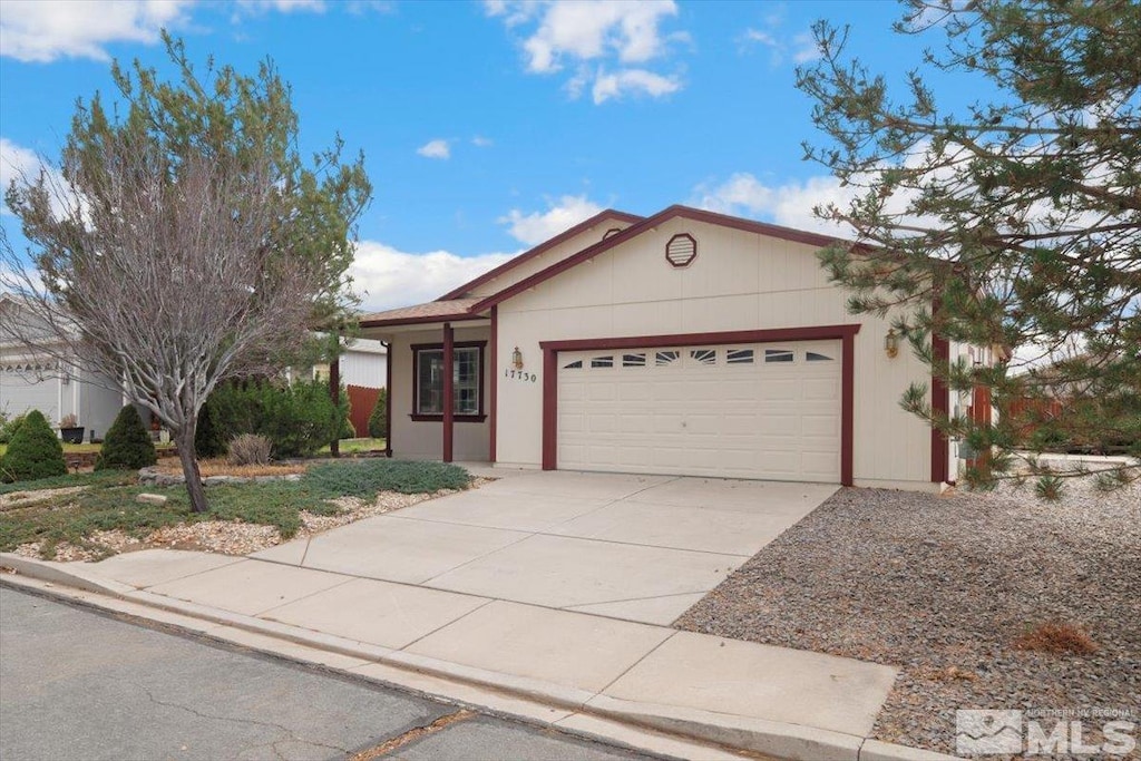 ranch-style home featuring a garage