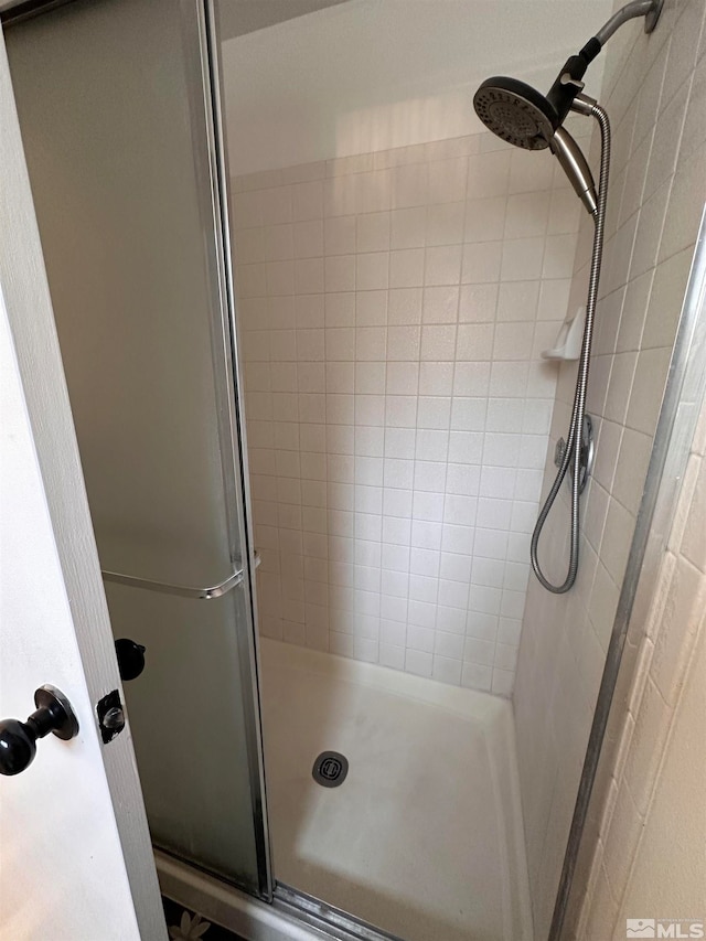 bathroom featuring an enclosed shower