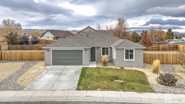 ranch-style house with a garage and a front yard