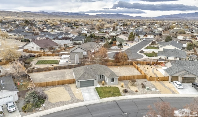 birds eye view of property featuring a mountain view