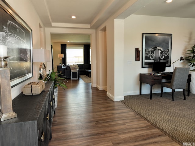 hallway with dark hardwood / wood-style flooring