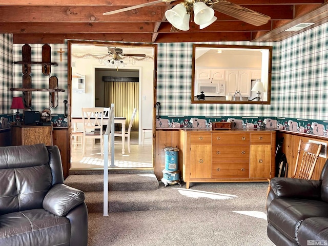 living room with carpet flooring and beamed ceiling