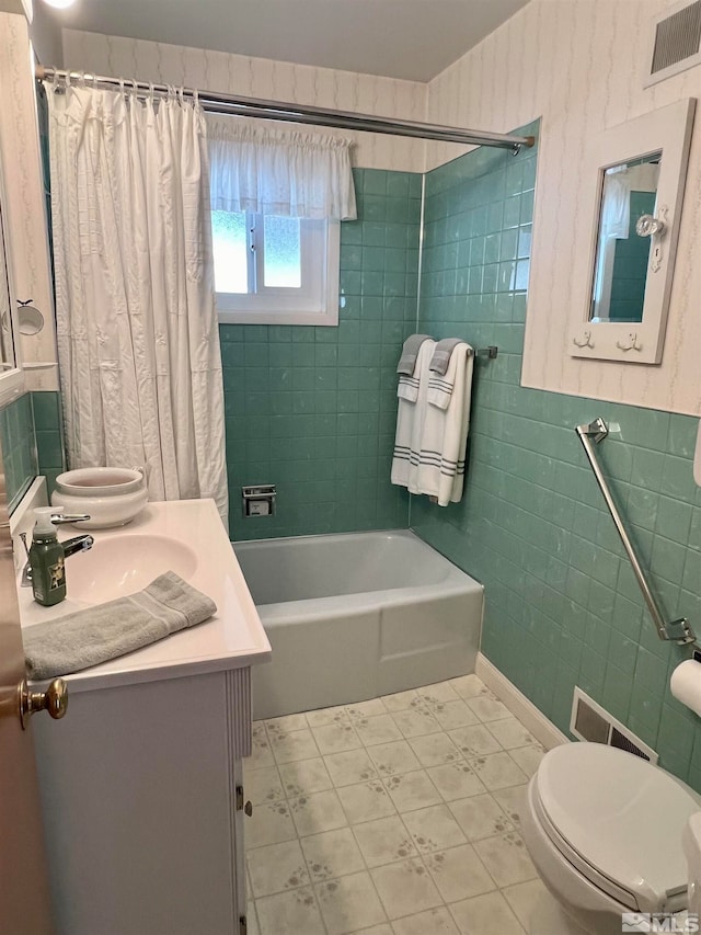 full bathroom with tile patterned floors, vanity, toilet, and shower / bathtub combination with curtain