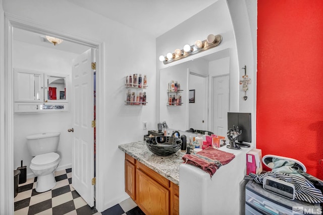 bathroom with vanity and toilet