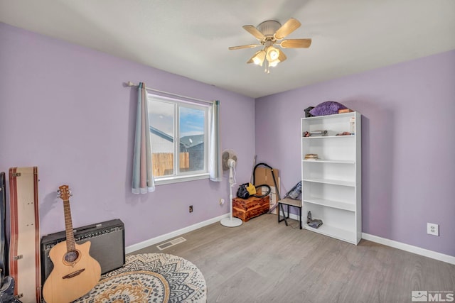 miscellaneous room featuring ceiling fan and light wood-type flooring