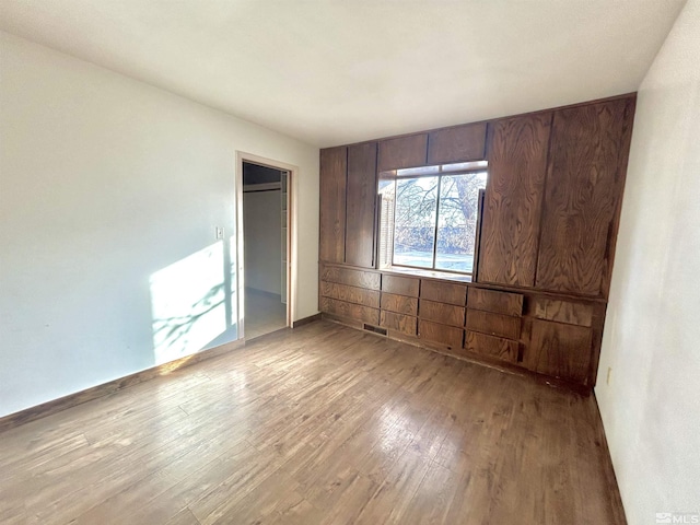 unfurnished bedroom featuring hardwood / wood-style floors