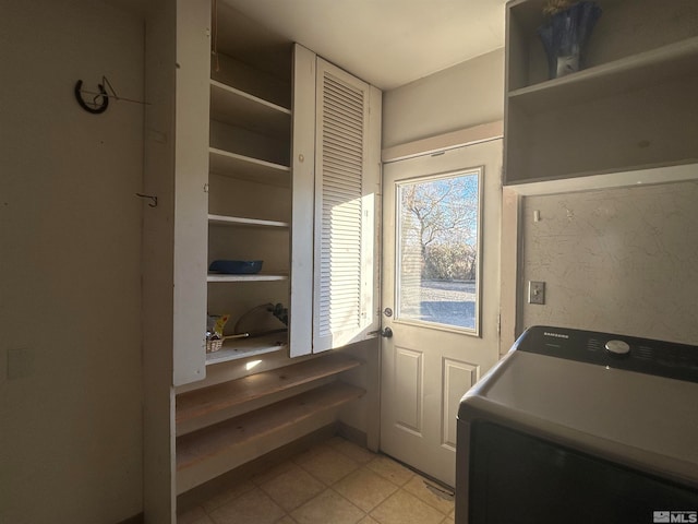 clothes washing area featuring washer / dryer