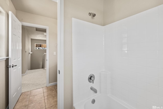 bathroom featuring tile patterned floors and shower / bathtub combination