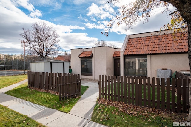 exterior space featuring a storage shed