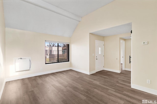 unfurnished room with vaulted ceiling with beams and dark wood-type flooring