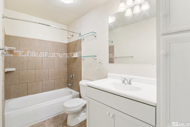 full bathroom with toilet, vanity, tile patterned floors, and tiled shower / bath