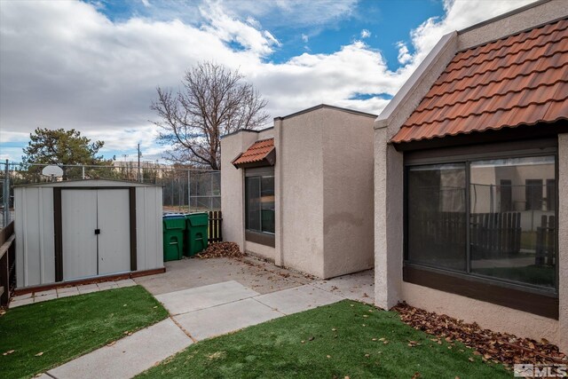 view of patio / terrace featuring a shed