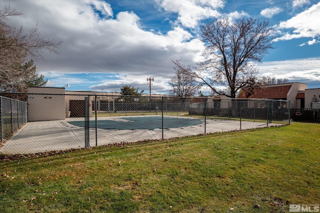 view of pool featuring a yard