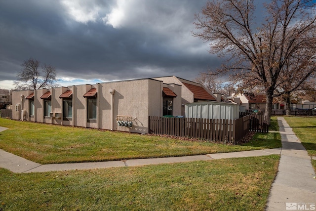 view of home's exterior featuring a yard