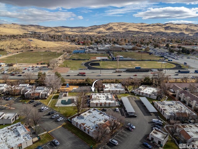 birds eye view of property with a mountain view