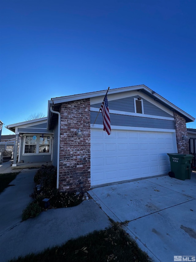 view of side of property featuring a garage