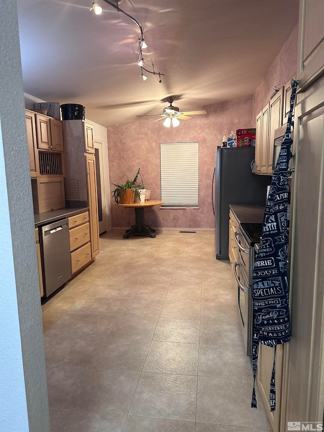 kitchen featuring stainless steel appliances, track lighting, and ceiling fan