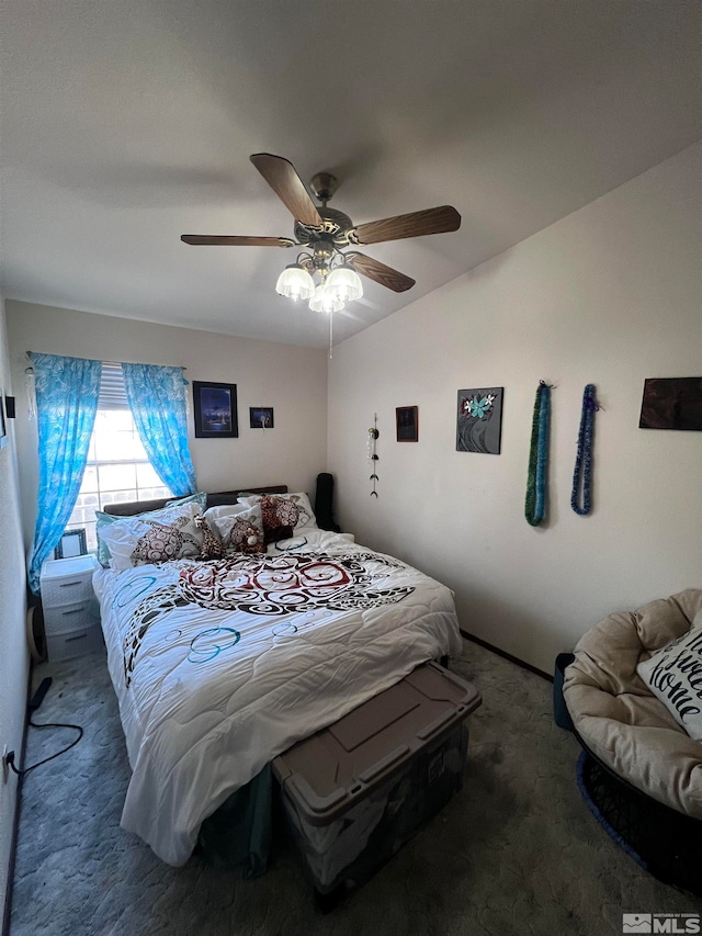 bedroom featuring dark colored carpet and ceiling fan