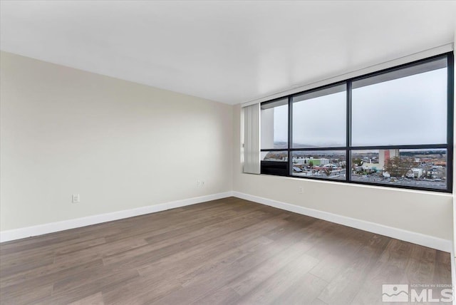 spare room featuring hardwood / wood-style flooring