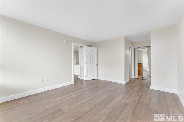 empty room with light wood-type flooring