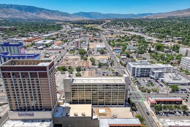 birds eye view of property with a mountain view