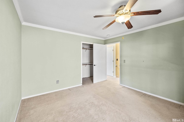 unfurnished bedroom featuring ceiling fan, ornamental molding, light carpet, and a closet