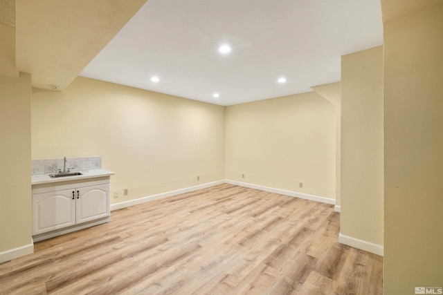 interior space with light hardwood / wood-style floors and sink