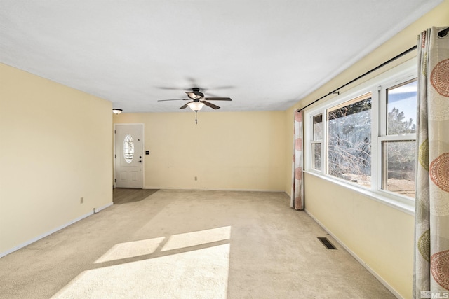 carpeted empty room with ceiling fan