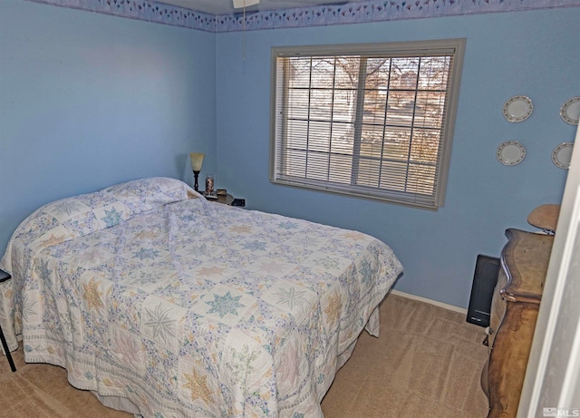 bedroom with light colored carpet