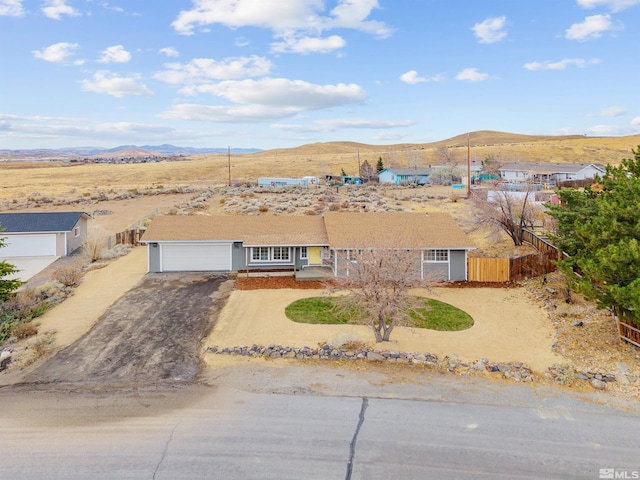 single story home with a mountain view and a garage