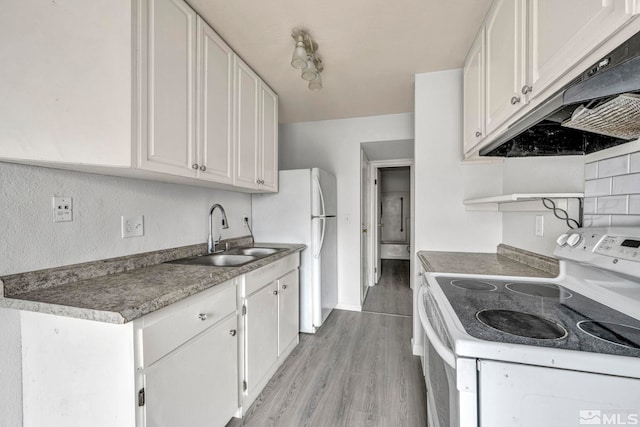 kitchen with white cabinets, light wood-type flooring, white electric range, and sink