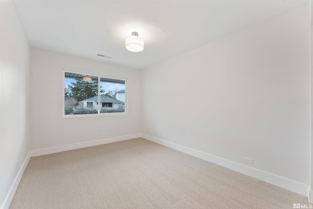 empty room featuring carpet flooring