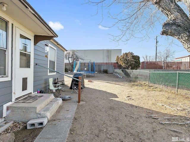 view of yard featuring a trampoline