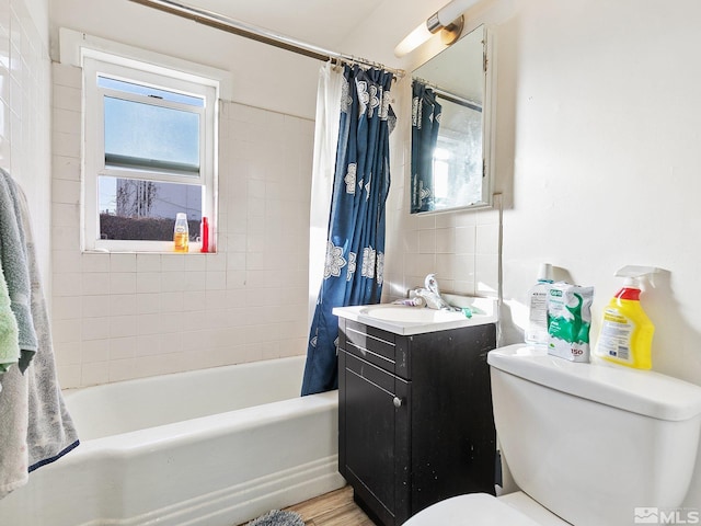 full bathroom featuring shower / bath combination with curtain, toilet, and vanity