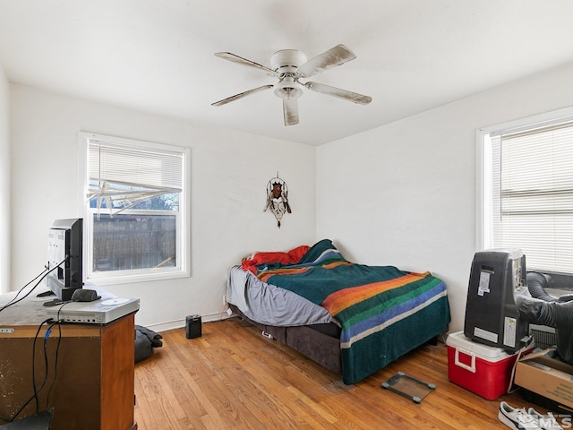 bedroom featuring hardwood / wood-style flooring and ceiling fan