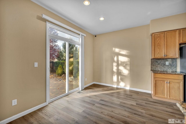 unfurnished dining area with hardwood / wood-style floors