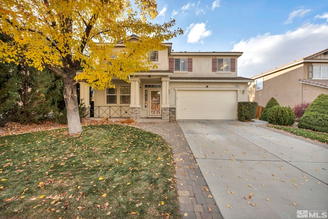 view of front property featuring a front yard and a garage