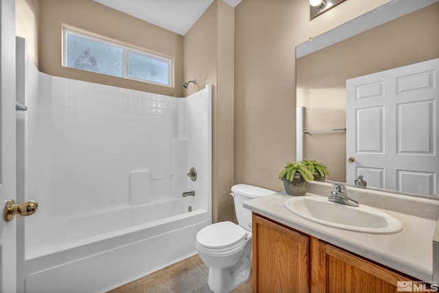 full bathroom featuring vanity, shower / bath combination, and toilet