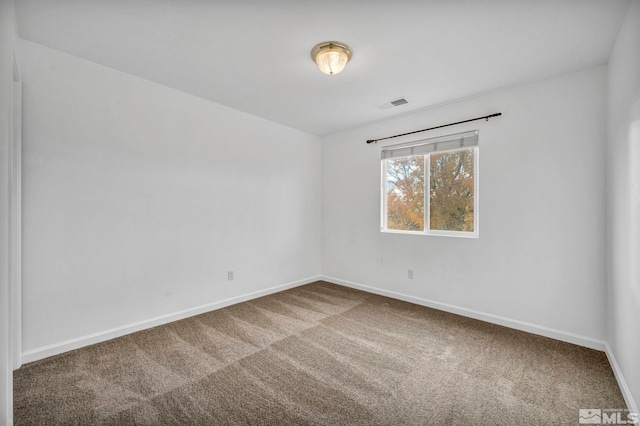 spare room featuring carpet floors