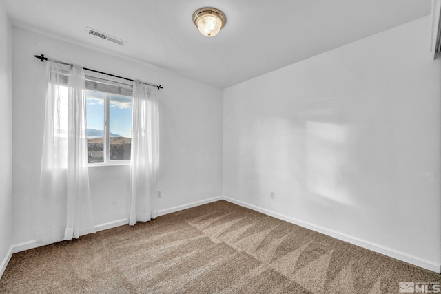 empty room featuring carpet floors