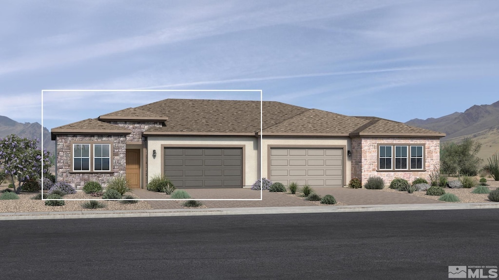 view of front facade featuring a mountain view and a garage