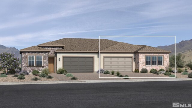 view of front of home featuring a mountain view and a garage