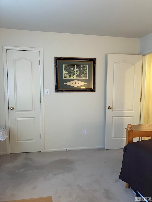 bedroom featuring light colored carpet